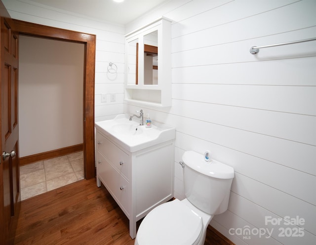 4879 Denton Chapel Rd, Morganton, NC 28655 - bathroom with vanity, wood finished floors, and wooden walls