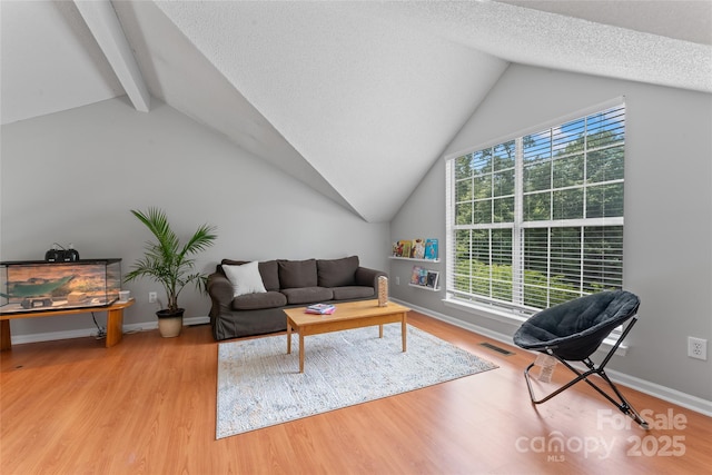 10043 Elsenham Ln, Charlotte, NC 28269 - living area featuring wood finished floors and a textured ceiling