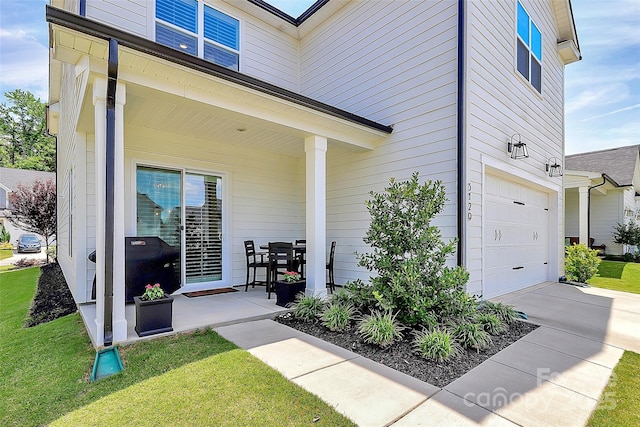 5129 Whitman Ave, Matthews, NC 28105 - property entrance featuring an attached garage, a lawn, and driveway