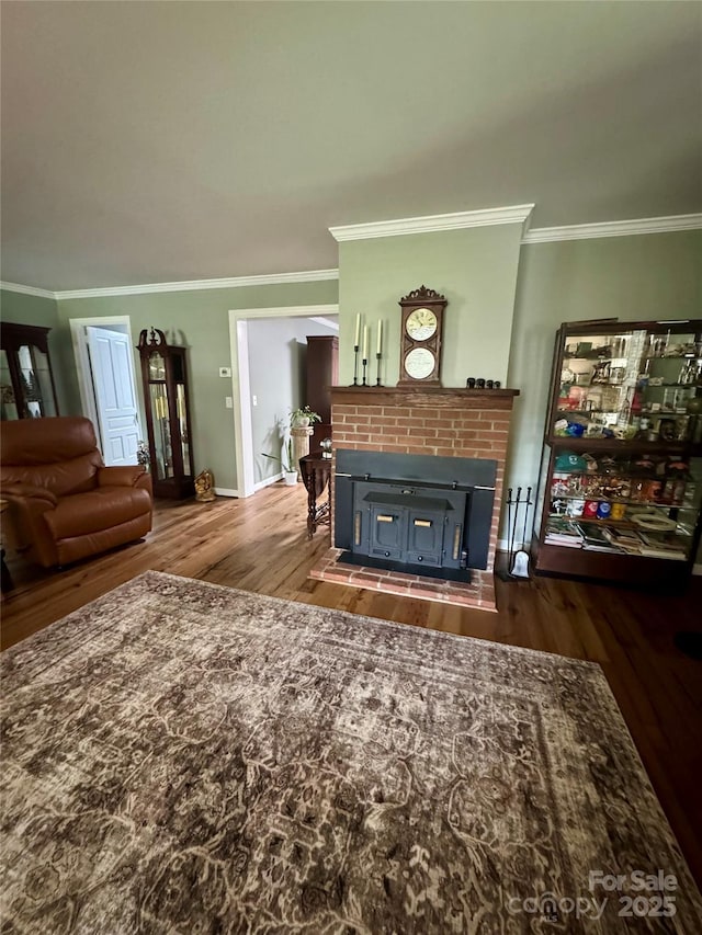 300 Blackmon St S, Bethune, SC 29009 - living room with ornamental molding, a brick fireplace, and dark wood-style flooring