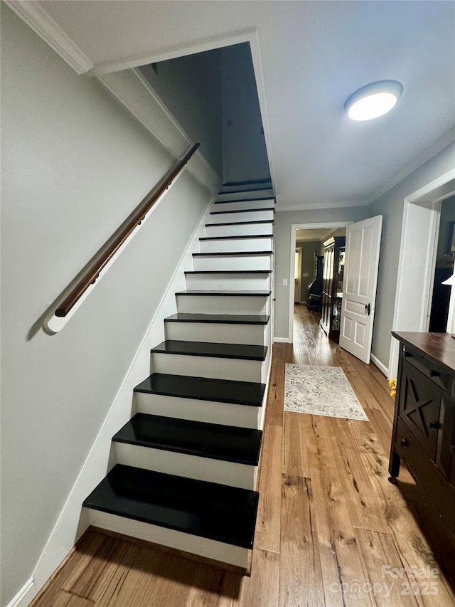 300 Blackmon St S, Bethune, SC 29009 - staircase with wood finished floors and crown molding