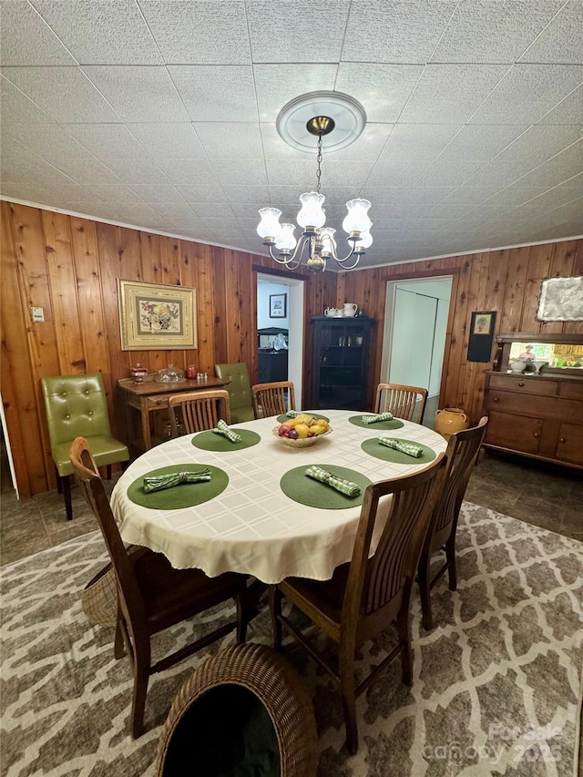 300 Blackmon St S, Bethune, SC 29009 - dining room with a chandelier and wooden walls