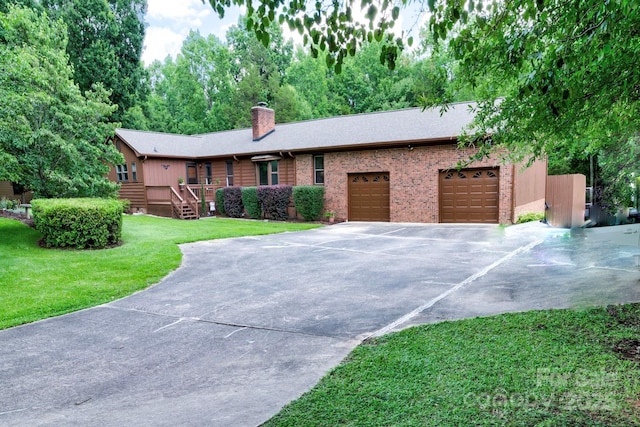 4004 Stillwater Ct, York, SC 29745 - single story home with an attached garage, a chimney, driveway, a front lawn, and brick siding