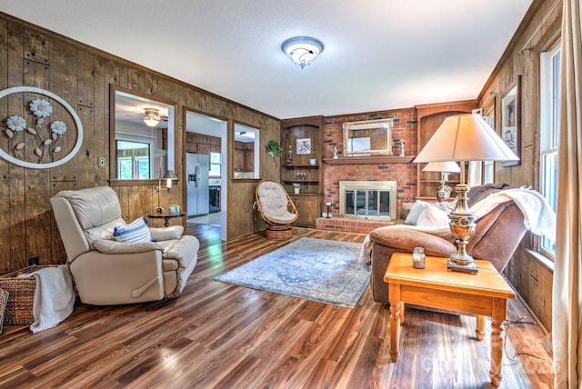 4004 Stillwater Ct, York, SC 29745 - living area with wooden walls, wood finished floors, crown molding, and a fireplace