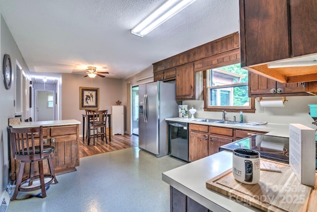 4004 Stillwater Ct, York, SC 29745 - kitchen with black dishwasher, stainless steel refrigerator with ice dispenser, light countertops, ceiling fan, and a textured ceiling