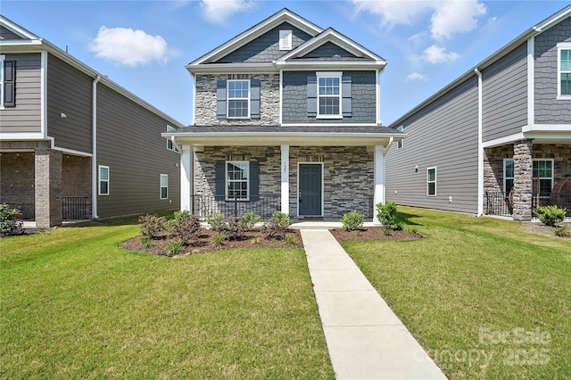 125 Cedar Knoll Cir, Pineville, NC 28134 - craftsman inspired home with stone siding, a porch, and a front lawn