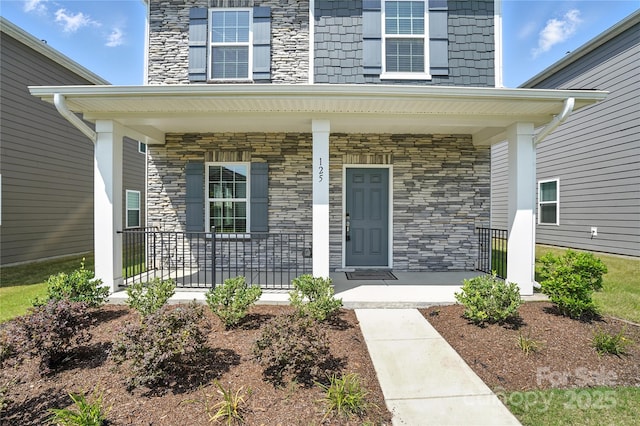 125 Cedar Knoll Cir, Pineville, NC 28134 - doorway to property with a porch and stone siding