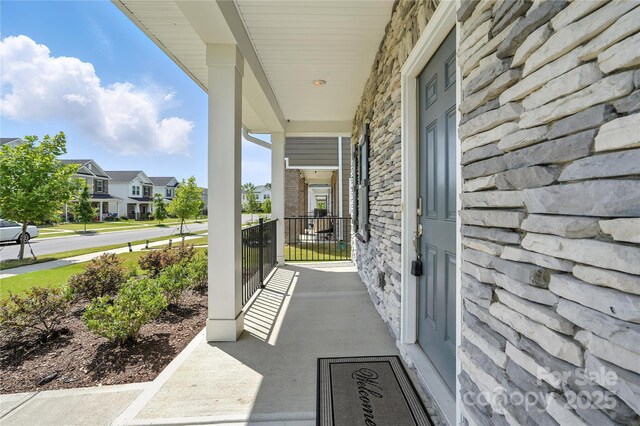 125 Cedar Knoll Cir, Pineville, NC 28134 - porch featuring a residential view