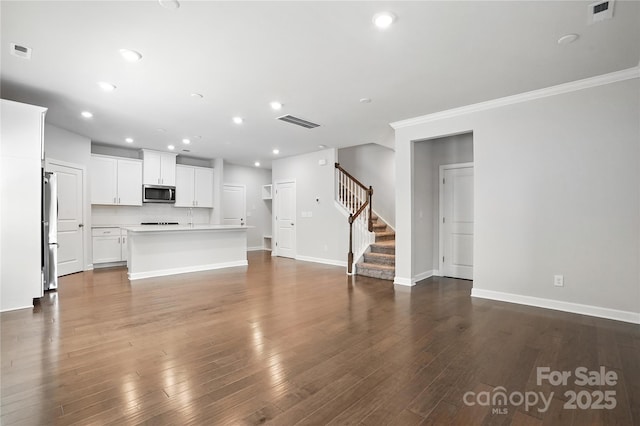 125 Cedar Knoll Cir, Pineville, NC 28134 - unfurnished living room with stairs, crown molding, recessed lighting, and dark wood-style flooring