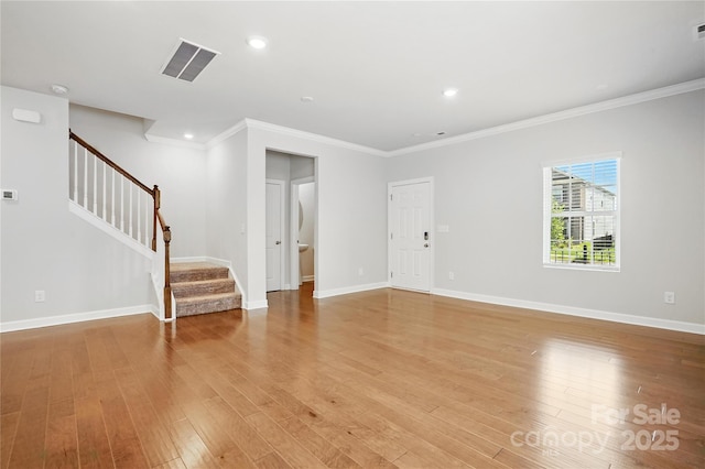 125 Cedar Knoll Cir, Pineville, NC 28134 - unfurnished living room featuring stairs, crown molding, light wood-type flooring, and recessed lighting
