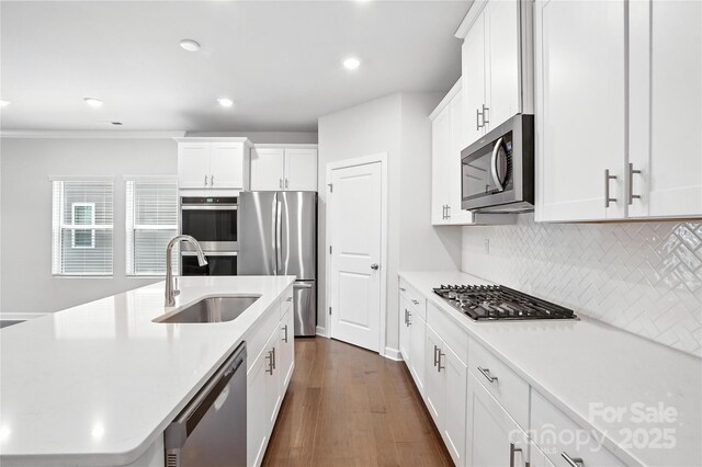 125 Cedar Knoll Cir, Pineville, NC 28134 - kitchen featuring stainless steel appliances, light countertops, dark wood-style floors, backsplash, and white cabinets