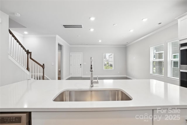 125 Cedar Knoll Cir, Pineville, NC 28134 - kitchen featuring ornamental molding, recessed lighting, light countertops, open floor plan, and white cabinets