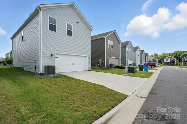 125 Cedar Knoll Cir, Pineville, NC 28134 - view of home's exterior featuring a residential view, a garage, a yard, and concrete driveway