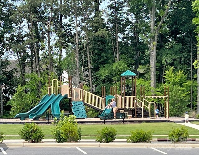 125 Cedar Knoll Cir, Pineville, NC 28134 - community play area with view of scattered trees and a yard