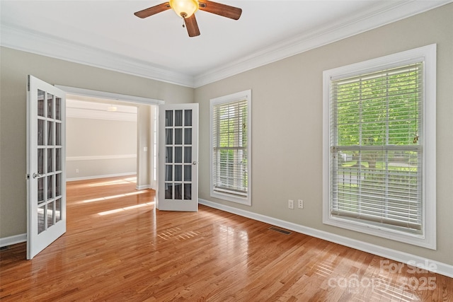 1812 Mill Chase Ln, Waxhaw, NC 28173 - spare room featuring french doors, ornamental molding, a ceiling fan, and wood finished floors