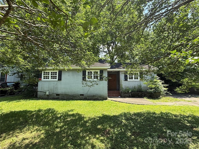 1317 Moretz Ave, Charlotte, NC 28206 - view of front of home with crawl space, a front lawn, and brick siding