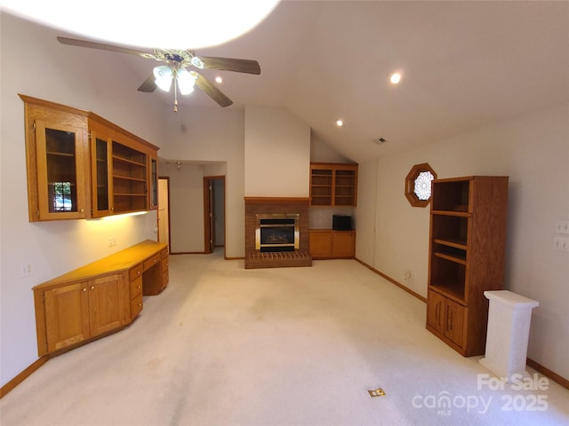 110 Kimberly Ln, Kings Mountain, NC 28086 - unfurnished living room featuring ceiling fan, light colored carpet, lofted ceiling, and a brick fireplace