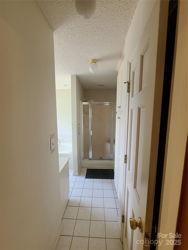 110 Kimberly Ln, Kings Mountain, NC 28086 - hallway with light tile patterned flooring and a textured ceiling