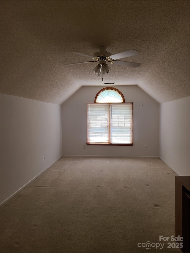 110 Kimberly Ln, Kings Mountain, NC 28086 - bonus room featuring light colored carpet, ceiling fan, vaulted ceiling, and a textured ceiling