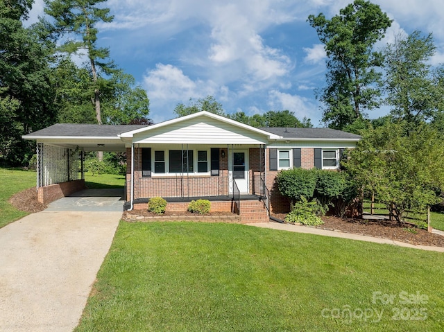 308 Maple St, Hudson, NC 28638 - single story home with driveway, brick siding, a front lawn, covered porch, and a carport
