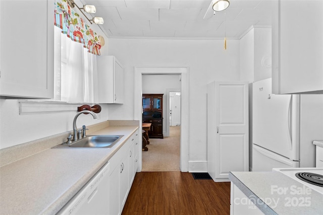 23 Oteen Park Pl, Asheville, NC 28805 - kitchen featuring white appliances, white cabinetry, light countertops, and dark wood-type flooring
