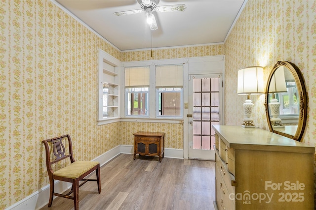 23 Oteen Park Pl, Asheville, NC 28805 - sitting room with light wood-style floors, wallpapered walls, ceiling fan, and ornamental molding