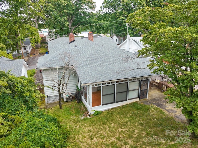23 Oteen Park Pl, Asheville, NC 28805 - back of house with roof with shingles, a chimney, a sunroom, and a yard