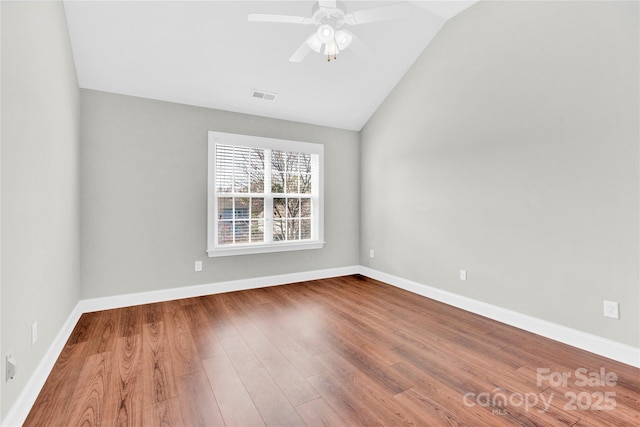 2275 Laurens Dr, Concord, NC 28027 - unfurnished room featuring vaulted ceiling, wood finished floors, and a ceiling fan