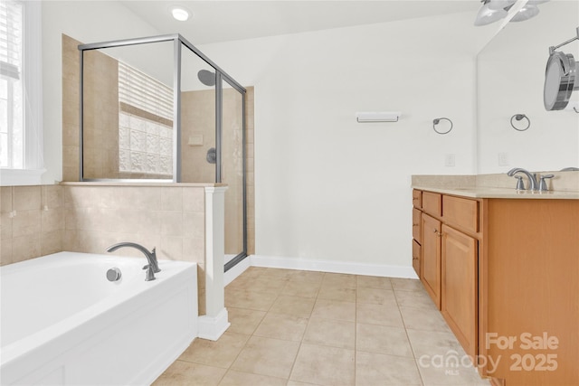 2275 Laurens Dr, Concord, NC 28027 - full bath featuring vanity, a shower stall, a bath, and tile patterned floors