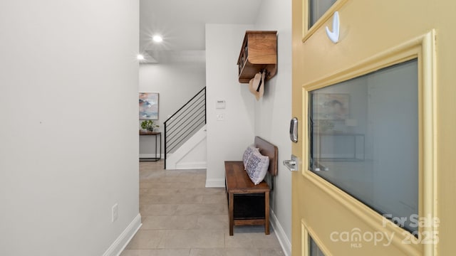 1011 Westbrook Dr Unit A, Charlotte, NC 28202 - hall featuring stairs, light tile patterned flooring, and recessed lighting