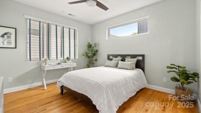 1011 Westbrook Dr Unit A, Charlotte, NC 28202 - bedroom with light wood-style flooring and a ceiling fan