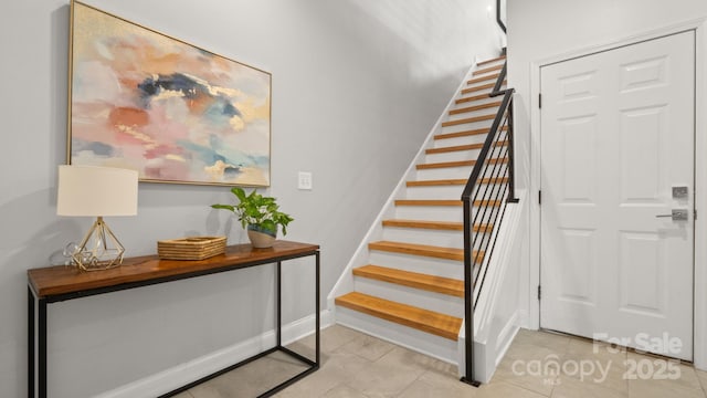1011 Westbrook Dr Unit A, Charlotte, NC 28202 - stairway featuring baseboards and tile patterned flooring