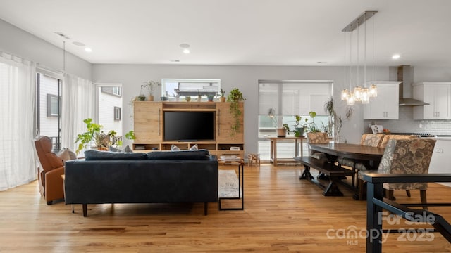 1011 Westbrook Dr Unit A, Charlotte, NC 28202 - living room featuring light wood finished floors and recessed lighting