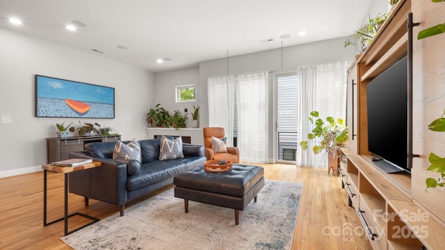 1011 Westbrook Dr Unit A, Charlotte, NC 28202 - living room with light wood-style floors and recessed lighting