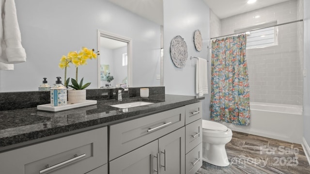 1011 Westbrook Dr Unit A, Charlotte, NC 28202 - bathroom with vanity, wood finished floors, and shower / tub combo with curtain