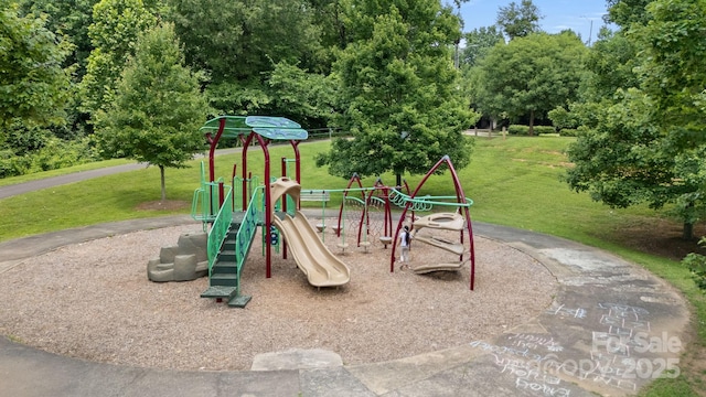 1011 Westbrook Dr Unit A, Charlotte, NC 28202 - community play area with a lawn and view of wooded area