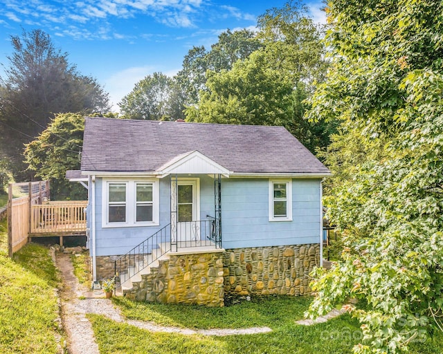 99 Little Oak St, Canton, NC 28716 - view of front facade featuring a shingled roof, a front lawn, and a deck