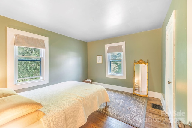 99 Little Oak St, Canton, NC 28716 - bedroom featuring multiple windows and wood finished floors