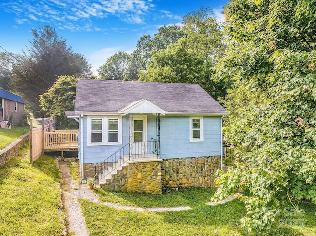 99 Little Oak St, Canton, NC 28716 - view of front of home with a front lawn, roof with shingles, and a deck