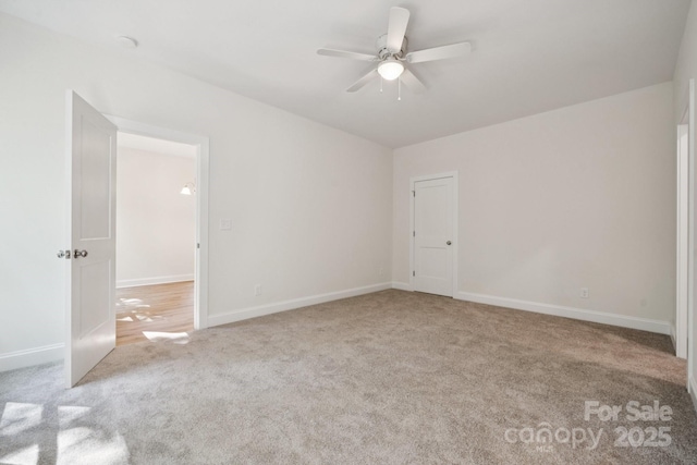54 Reed St NE, Concord, NC 28025 - carpeted empty room featuring a ceiling fan and baseboards
