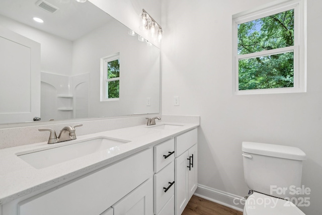 54 Reed St NE, Concord, NC 28025 - full bathroom featuring double vanity and wood finished floors