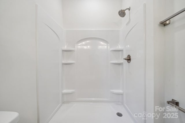 54 Reed St NE, Concord, NC 28025 - bathroom featuring a shower and toilet