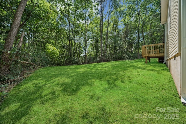 54 Reed St NE, Concord, NC 28025 - view of grassy yard with a wooden deck