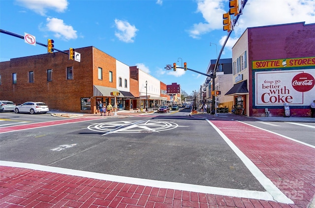 54 Reed St NE, Concord, NC 28025 - view of asphalt road with traffic lights, sidewalks, and curbs