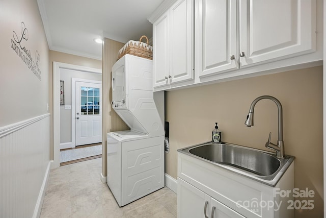 4824 Waxhaw Farms Rd, Waxhaw, NC 28173 - washroom with stacked washer and clothes dryer, cabinet space, and crown molding