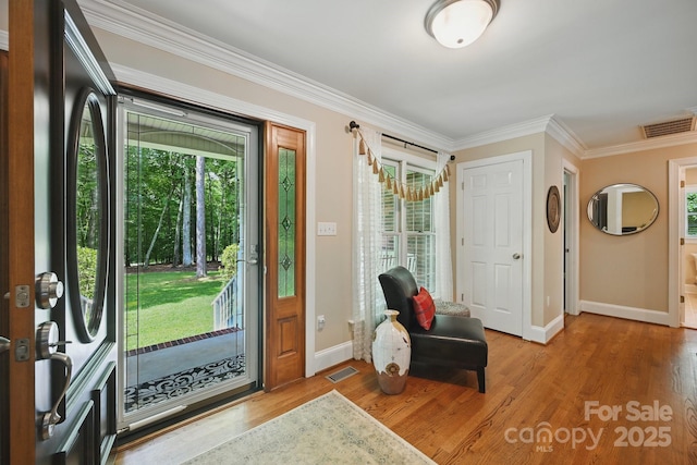 4824 Waxhaw Farms Rd, Waxhaw, NC 28173 - entrance foyer with healthy amount of natural light, crown molding, and wood finished floors