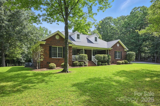 4824 Waxhaw Farms Rd, Waxhaw, NC 28173 - cape cod-style house with covered porch, brick siding, a front lawn, and crawl space