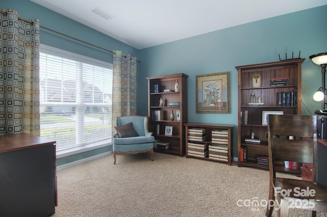 9792 Ravenscroft Ln NW, Concord, NC 28027 - living area with healthy amount of natural light and carpet
