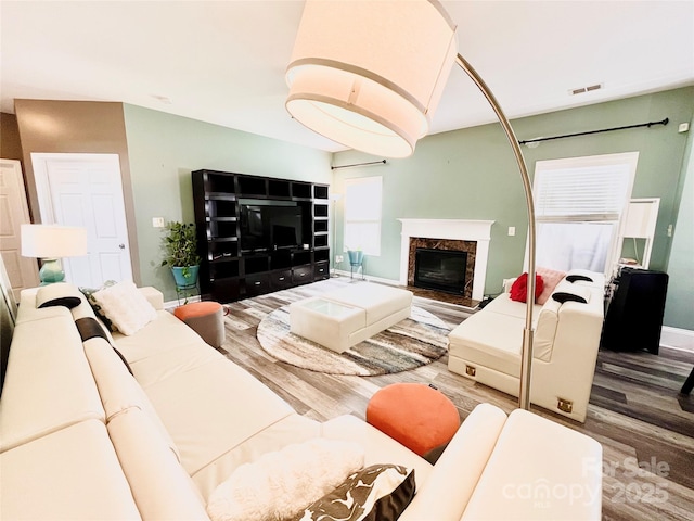 9792 Ravenscroft Ln NW, Concord, NC 28027 - living area featuring wood finished floors and a premium fireplace