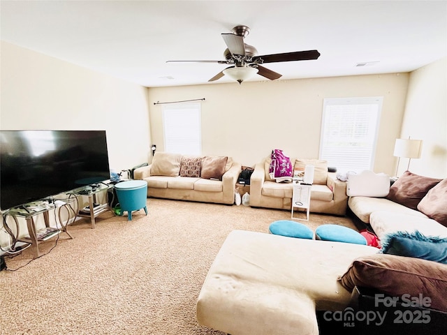 9792 Ravenscroft Ln NW, Concord, NC 28027 - carpeted living room with healthy amount of natural light and a ceiling fan